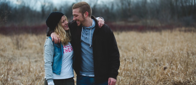 Happy couple near field 