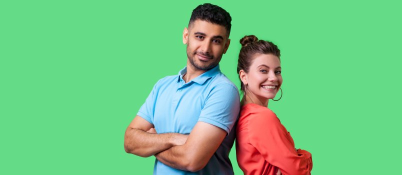 Emotional couple on green background