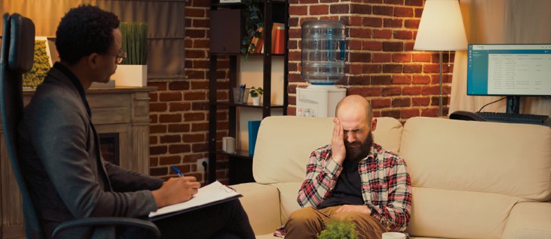 Man consulting at at therapy session