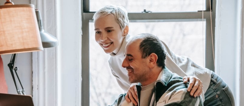 Couple working together on laptop
