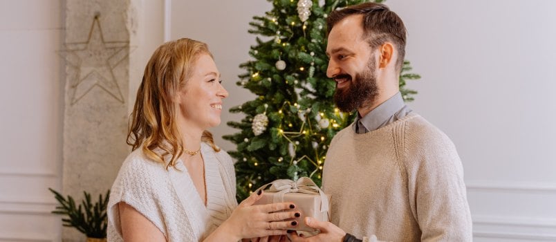 Man giving a gift to woman