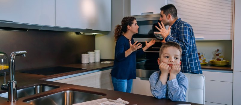 Parents arguing in front of children