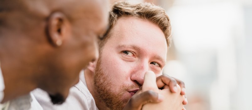 Happy man holding hand kisses
