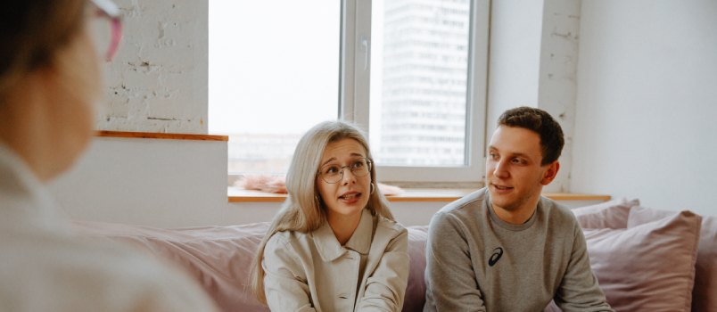 Couple talking with therapist