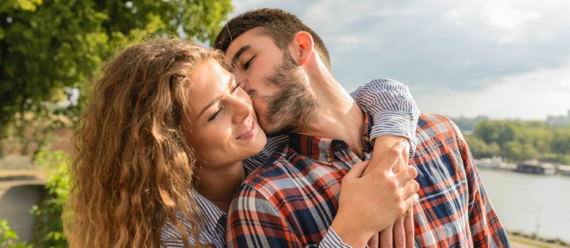Man kissing woman