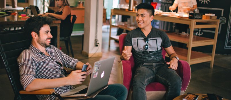 Man having conversation sitting on chair