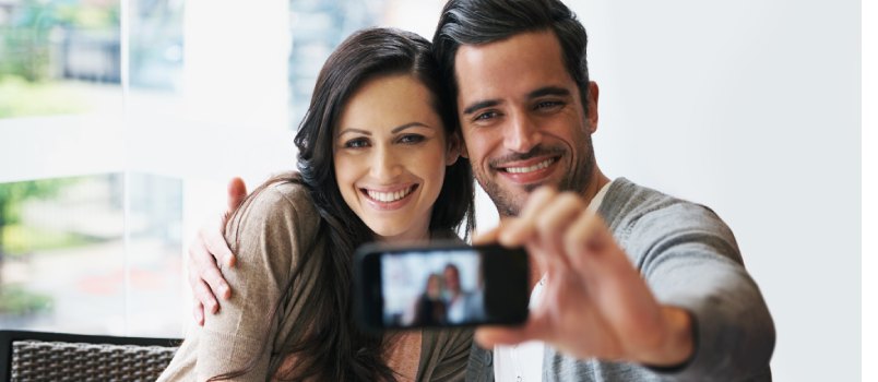 young couple taking photo