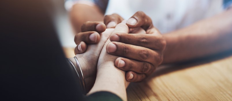 Couple holding each other hands