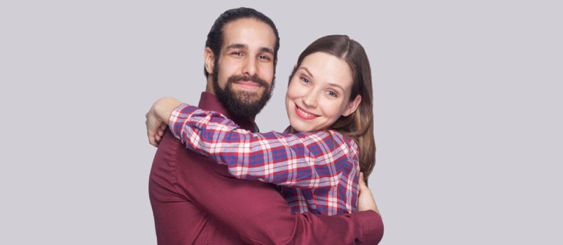 Emotional couple on grey background