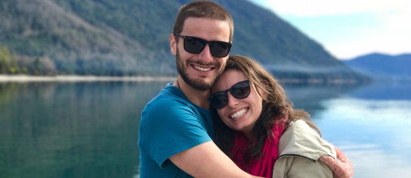 Couple hugging near the lake