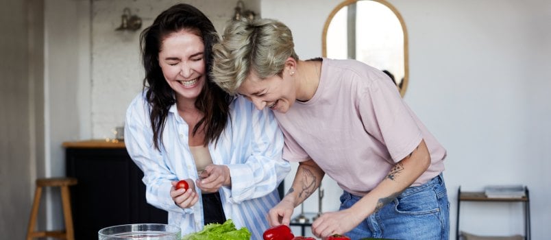 Happy girls preparing lunch