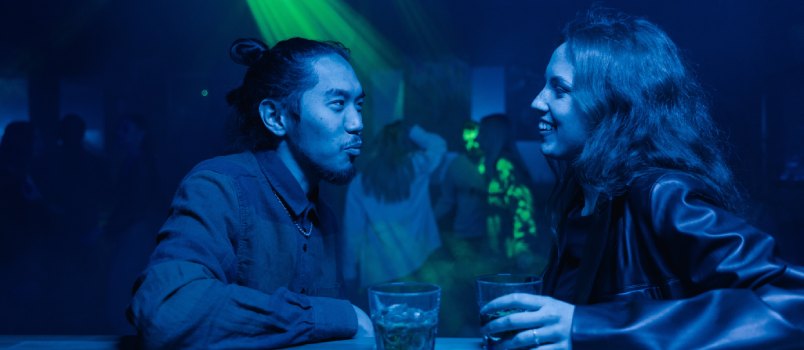 Man and woman talking while having drink