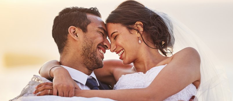 Couple showing love on their wedding day