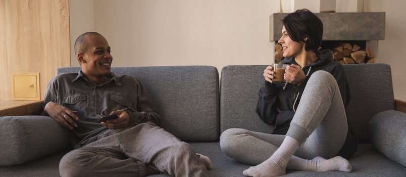 Happy couple talking over coffee