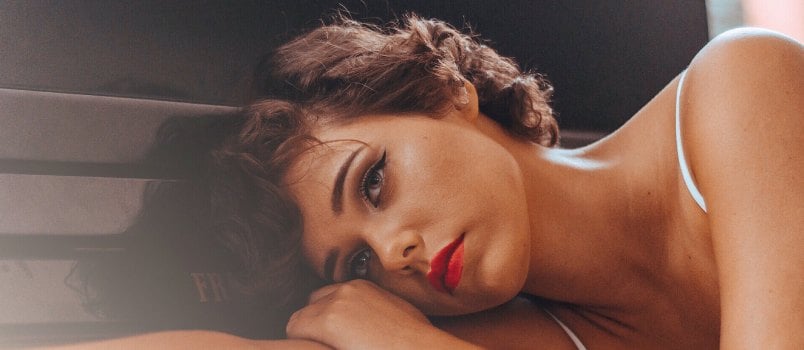 Woman leaning in piano