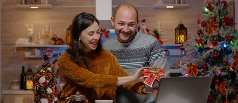 Couple giving present on video call