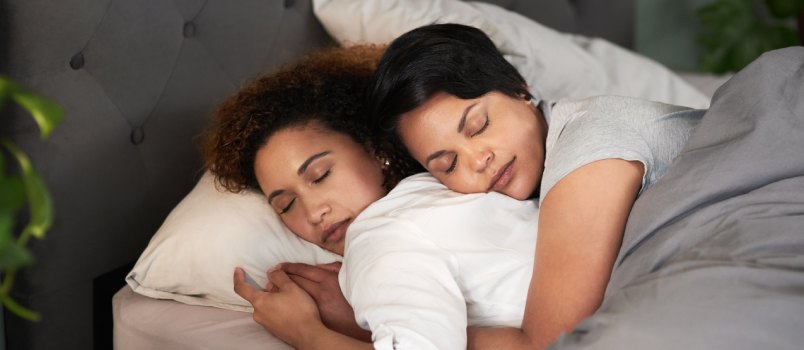 Couple sleeping in their bed