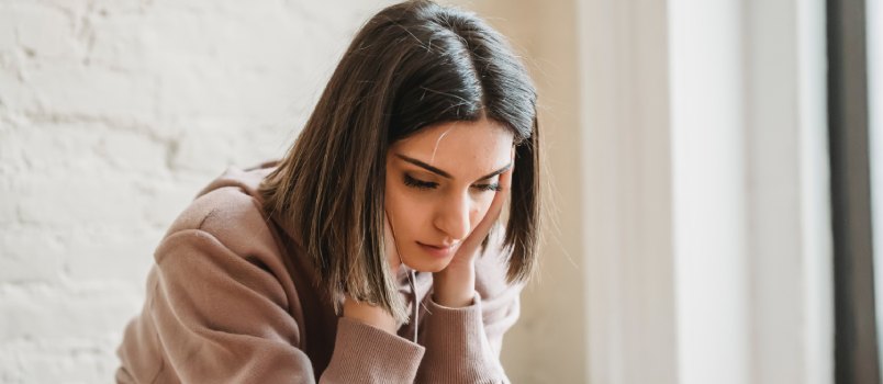 Sad woman sitting alone