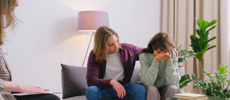 Couple discussing problems during session with psychologist