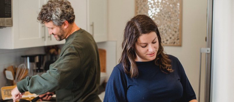 Couple working together in kitchen
