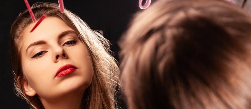 Woman with red lipstick on mirror