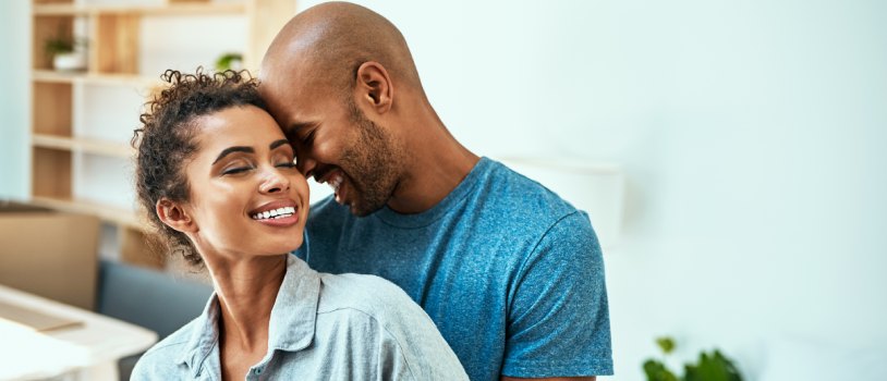 Young couple having romance in their room