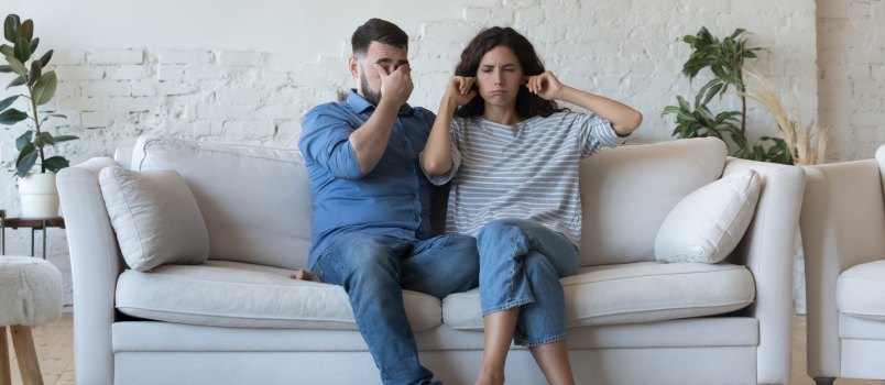 Stressed couple arguing at home