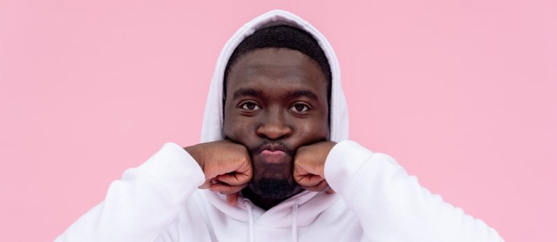 Unhappy childish black man