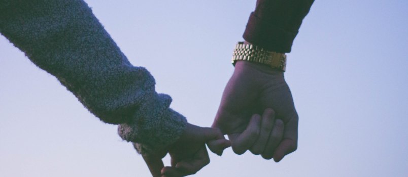 Couple holding hands