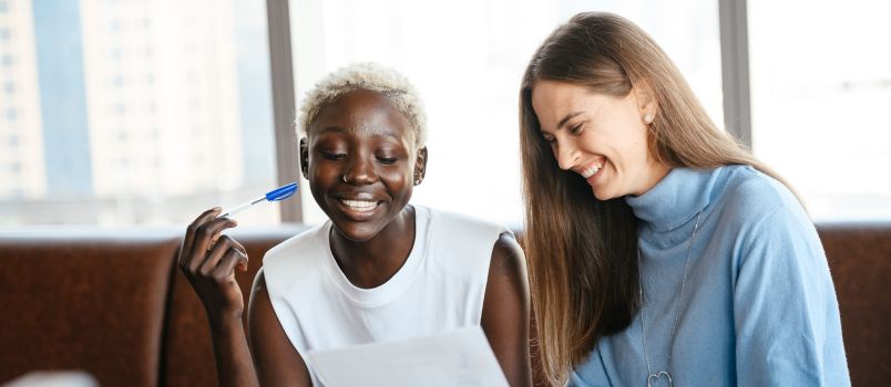 Colleague discussing contract in office