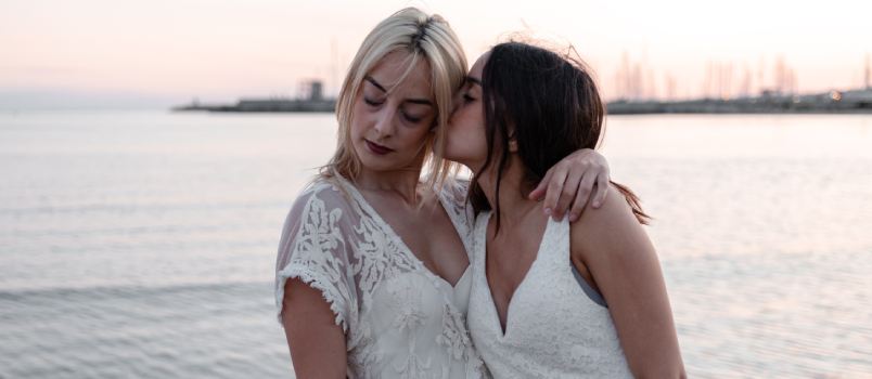 Woman kissing standing near water
