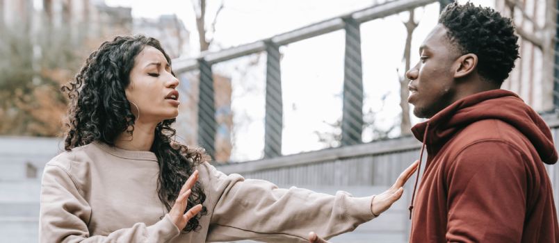 Couple having conflict on street