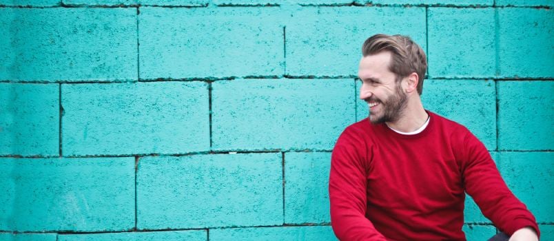 Man leaning on wall