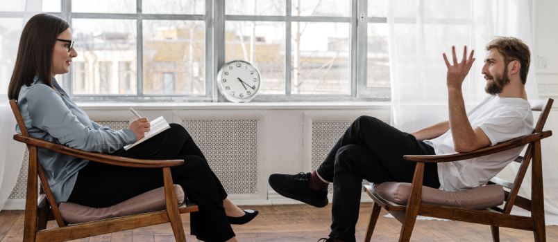 Man having session with therapist