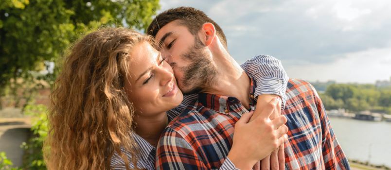 Man kissing woman