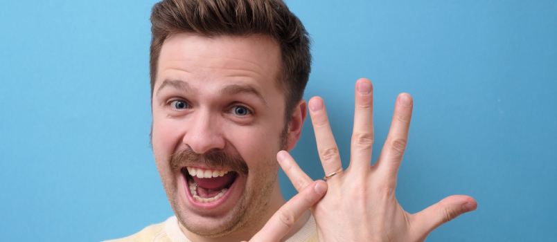 Excited man pointing towards ring