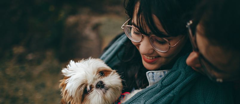 Couple holding puppy
