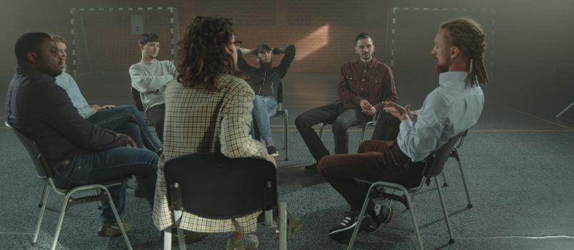 People sitting on chair inside gymnasium