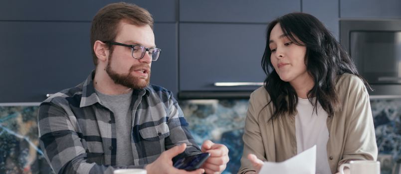 Man talking while looking at document