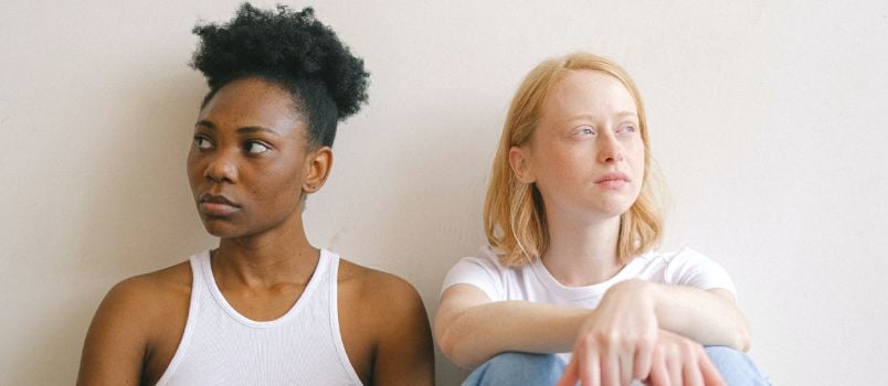 Woman sitting close together