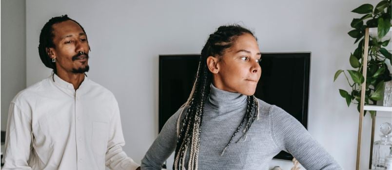 Man apologizing to woman