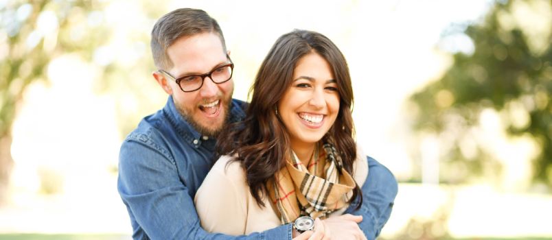 Man hugging woman from back