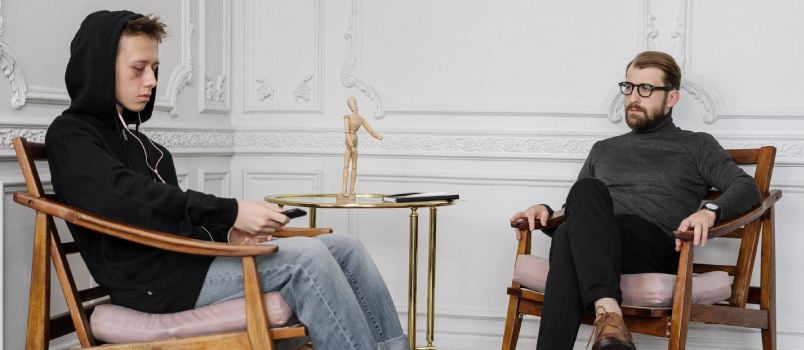 Two man talking with each other