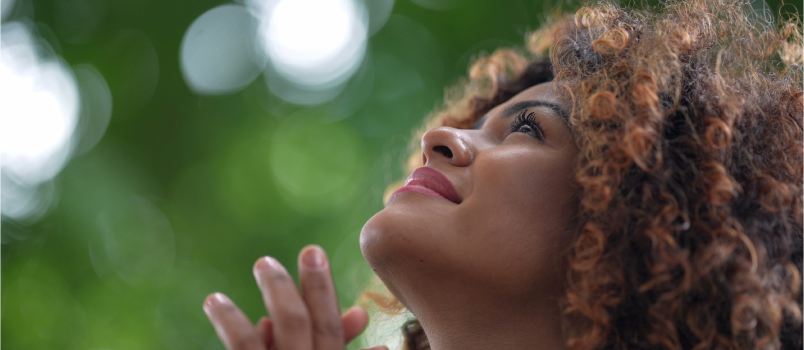 Woman worshipping god