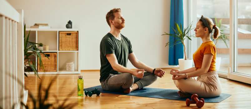 Couple doing yoga together 