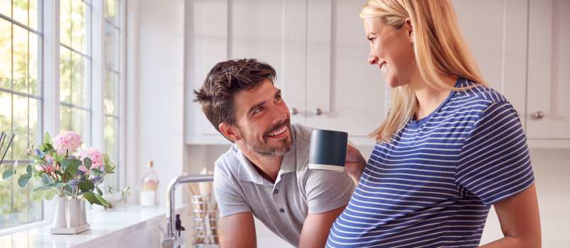 Couple talking in kitchen