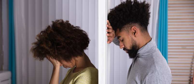 Unhappy couple standing