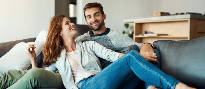Young couple relaxing at couch