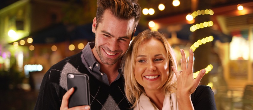 Girlfriend taking selfie with her boyfriend