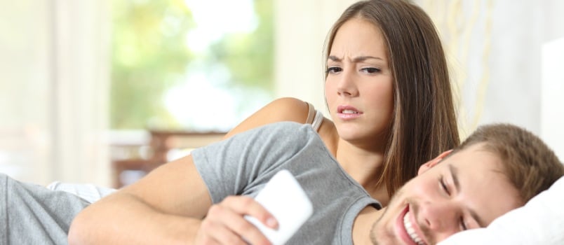 Jealous woman spying on her husband mobile